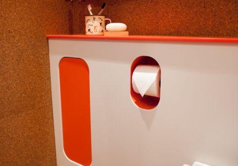 Hi-MACS WC panel with integral cupboard