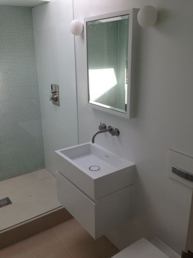 Corian Recessed Mirror Cabinet integral to Corian Walls