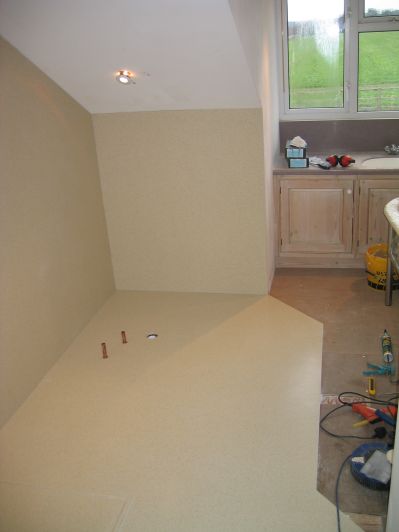 seamlessly joined wet room floor and wall panels