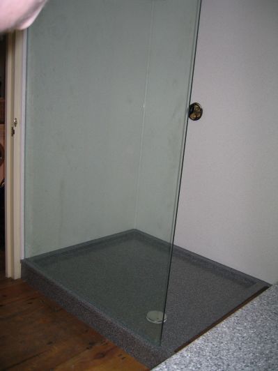 H-MACS Greystone Granite Custom Shower Tray with HI-MACS Gemini Wall Panels