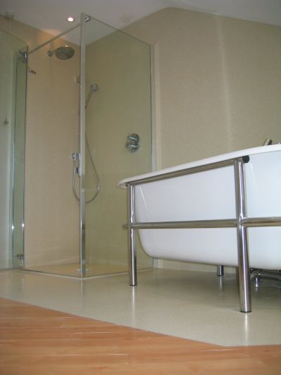 custom wet room butting up to different flooring in the same room