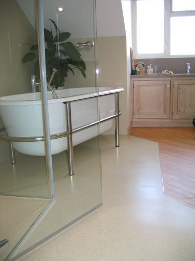 bespoke HI-MACS wet room floor join with laminate