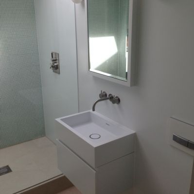 Corian Recessed Mirror Cabinet integral to Corian Walls