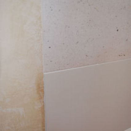 HI-MACS panel meets polished plaster and wood