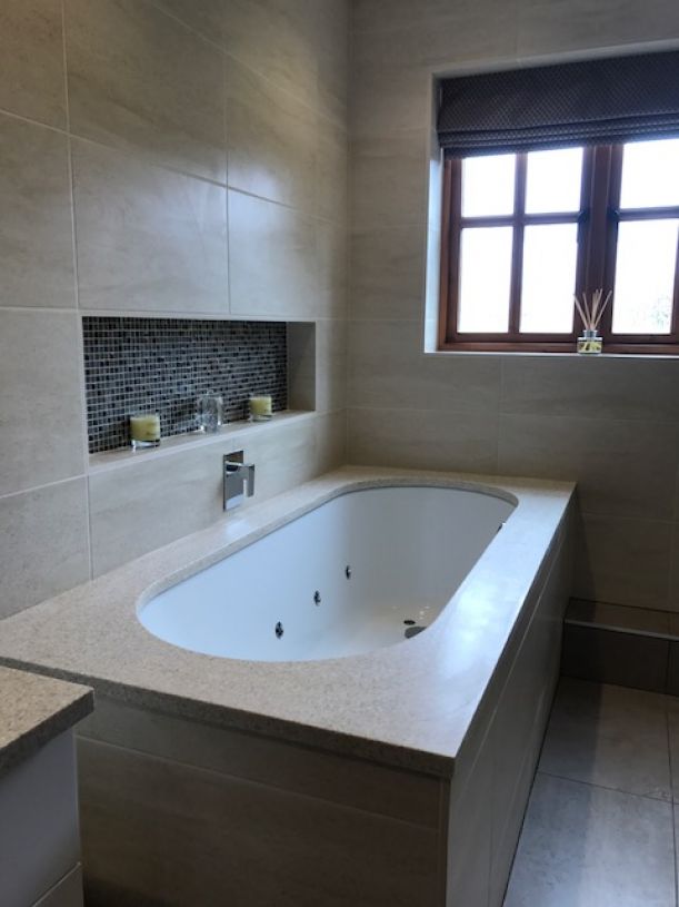 Bespoke Corian Over Bath Surround